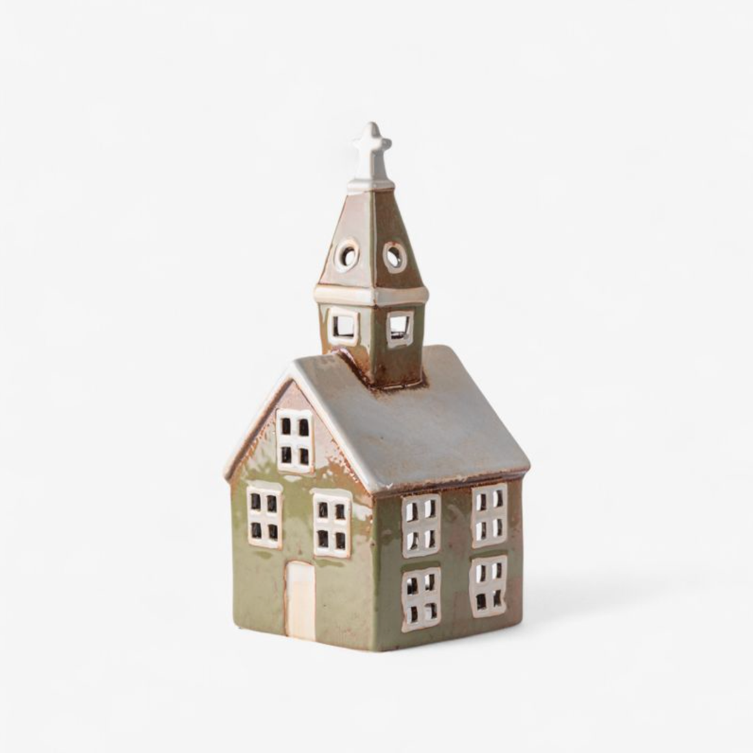 Small ceramic church with a steeple on a white background