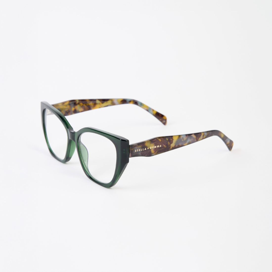 Green and tortoiseshell glasses on a white background