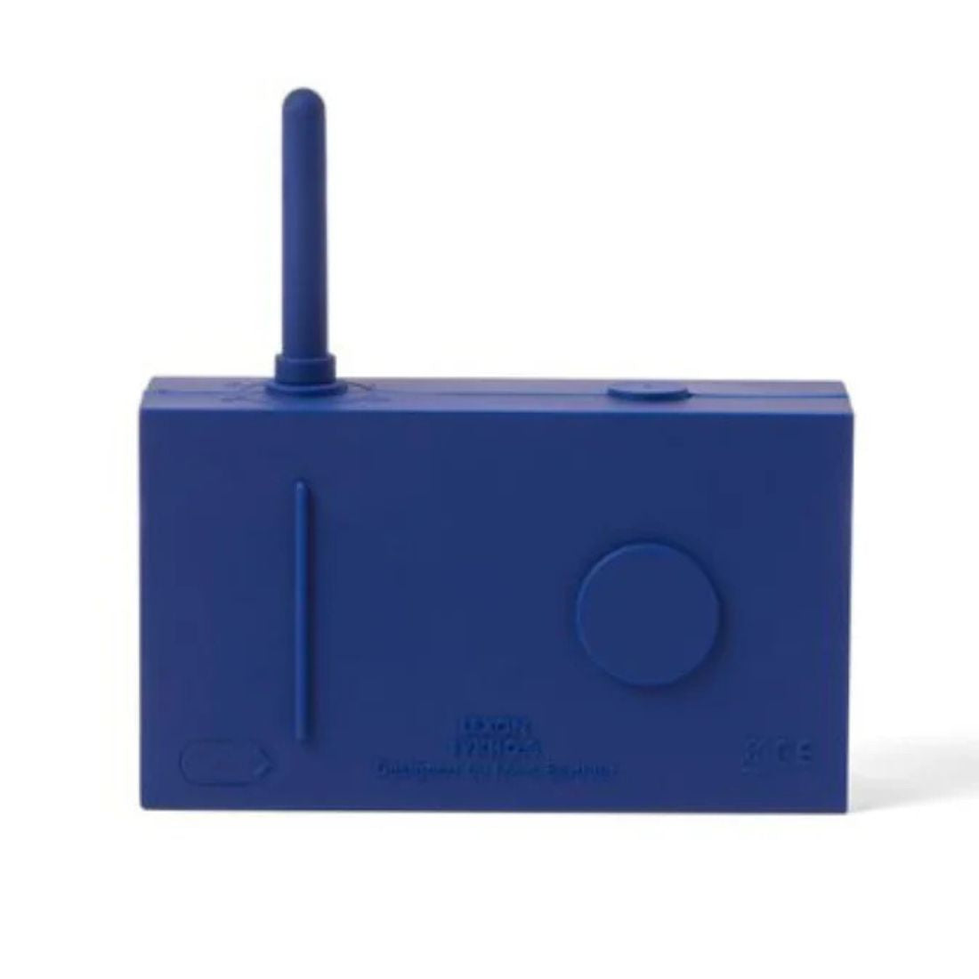 Back of a dark blue portable radio with antenna on a white background