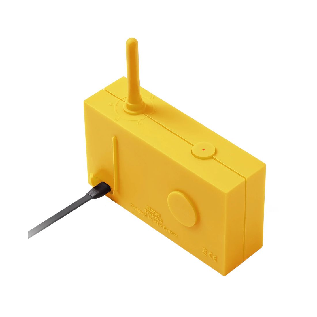 Yellow radio with an antenna with charge cable plugged in on a white background