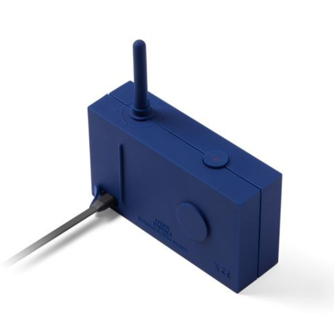 Dark Blue portable radio with an antenna and charge cable plugged in on a white background