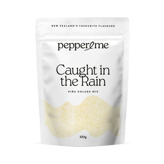 Pepper & Me 'Caught in the Rain' Piña Colada Mix packaging on a white background