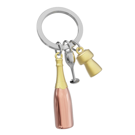 Keychain with champagne bottle, glass, and bucket charms on a white background
