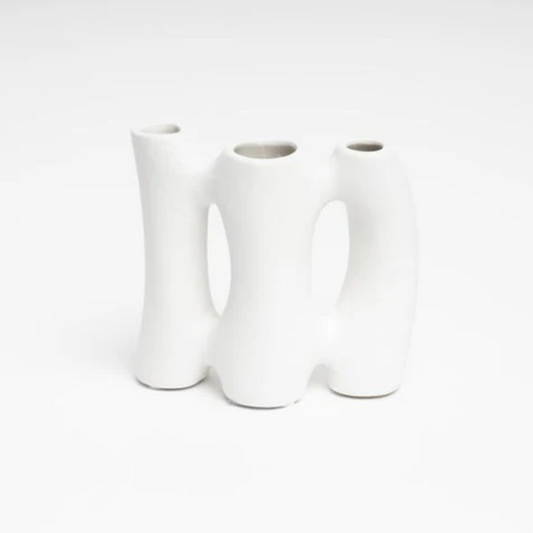 Three white ceramic vases on a white background