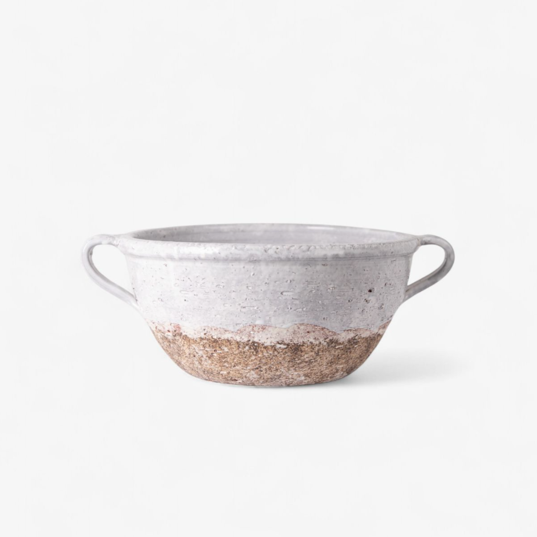 Gray ceramic bowl with a textured base on a white background
