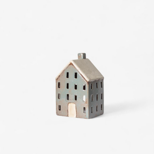 Small ceramic house on a white background
