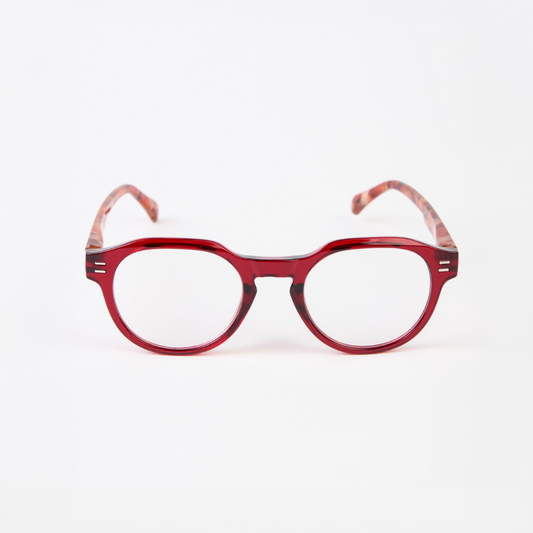 Red eyeglasses with a tortoiseshell pattern on a white background