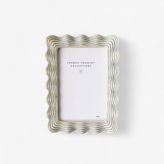 Decorative photo frame with wavy design on a white background