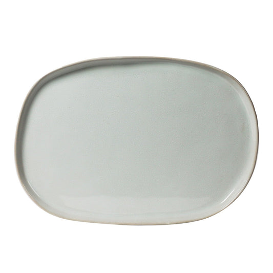 Oval ceramic plate with a light gray color on a white background